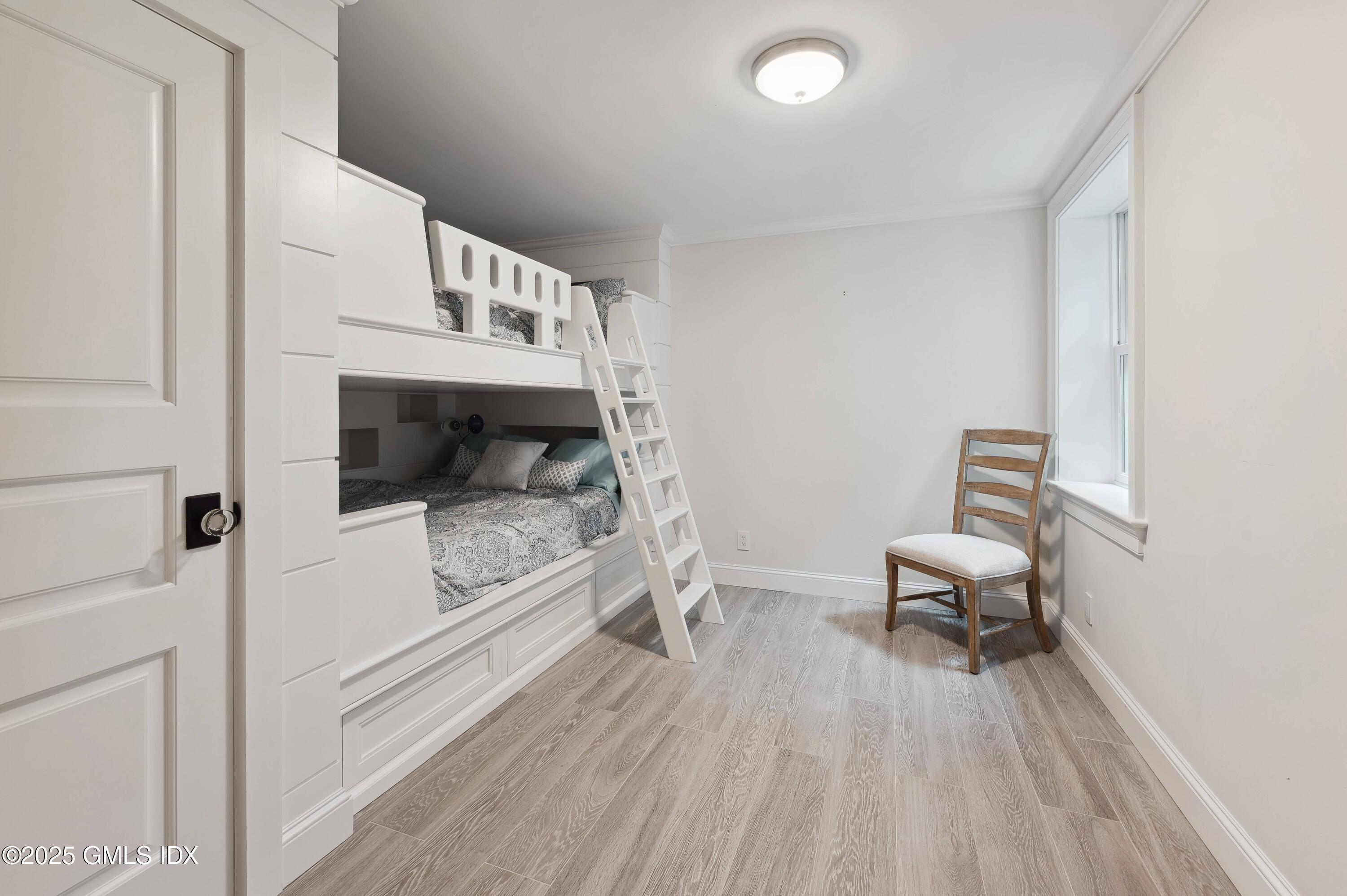 2 Sparrow Lane Greenwich, CT 06830 - Photo 24 of 28 a living room with a couch and a rug