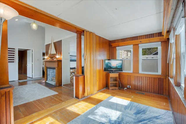 a bedroom with furniture and a window