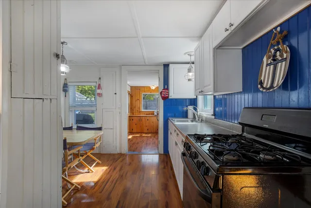 a kitchen with stainless steel appliances granite countertop a stove and a refrigerator