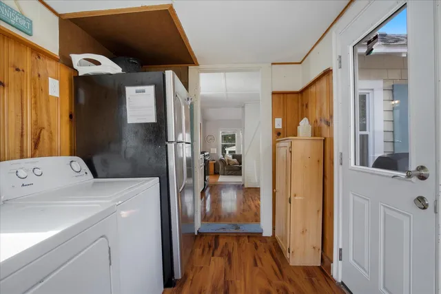 a view of hallway with wooden floor
