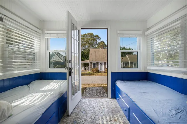 a bedroom with a large bed and a window