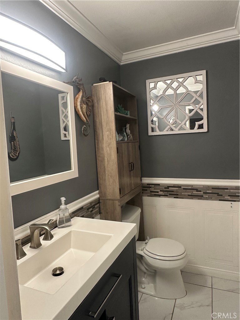 18223 Soledad Canyon Road, Unit 45 Canyon Country, CA 91387 - Photo 2 of 24 a bathroom with a toilet sink and mirror