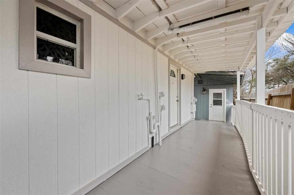 901 Valdez Street, Unit C Austin, TX 78741 - Photo 11 of 12 a view of a hallway with wooden shelves