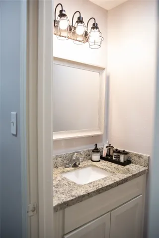 a front view of a house with a garden and plants