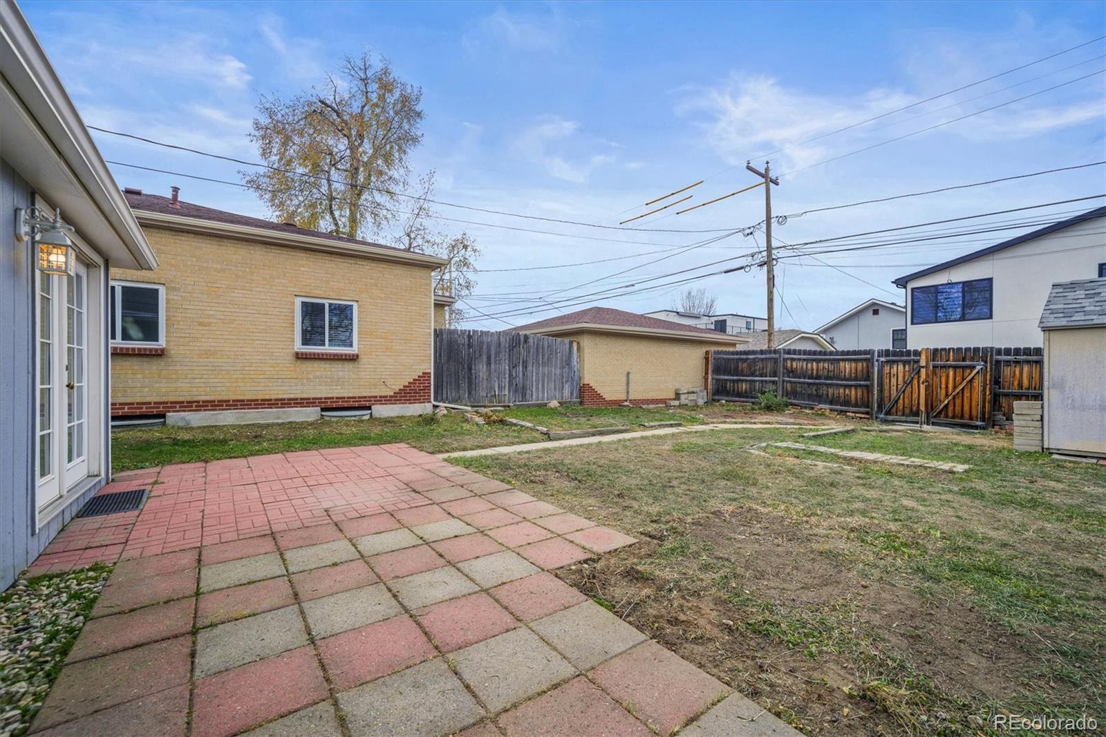 4551 Utica Street Denver, CO 80212 - Photo 21 of 32 a house view with a backyard space