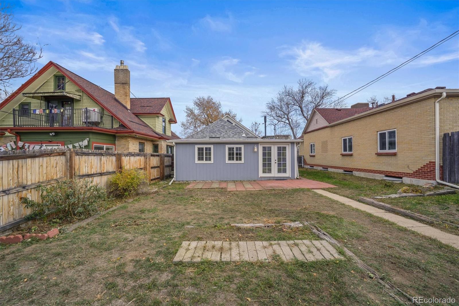 4551 Utica Street Denver, CO 80212 - Photo 24 of 32 a front view of a house with a yard