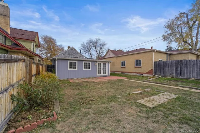 a view of a house with a backyard