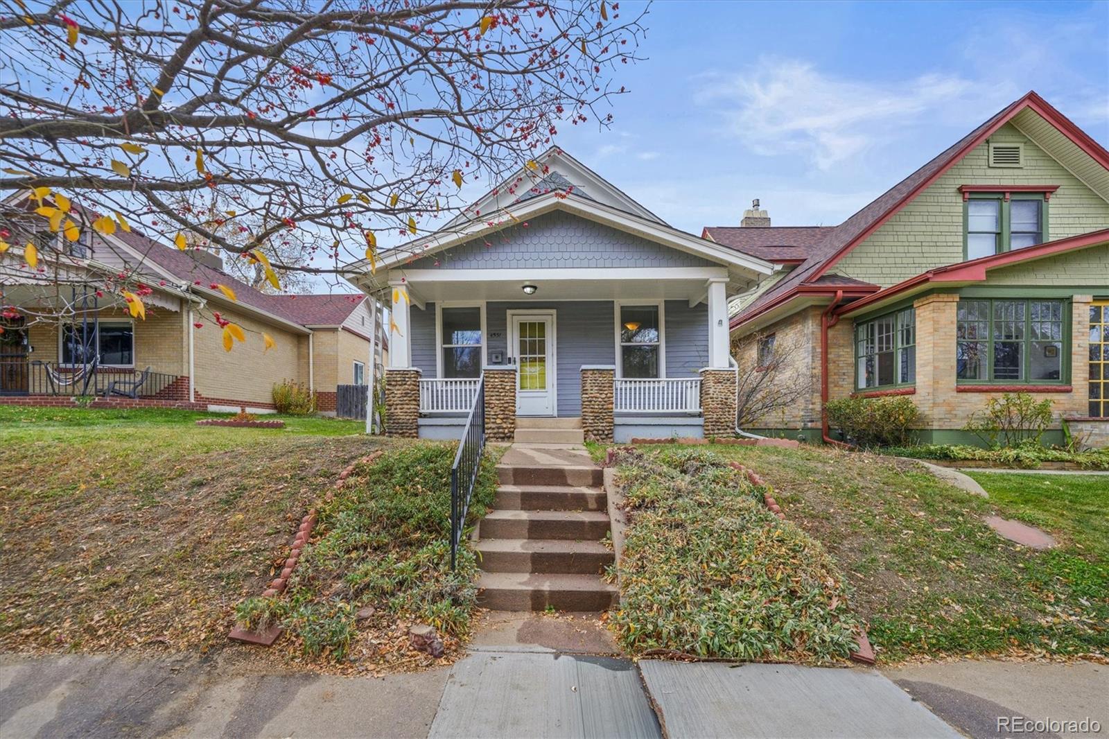 4551 Utica Street Denver, CO 80212 - Photo 30 of 32 a front view of a house with a yard