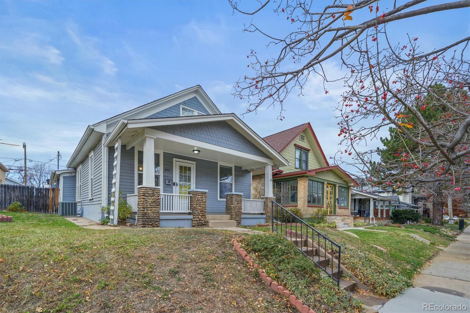4551 Utica Street Denver, CO 80212 - Photo 31 of 32 a front view of a house with a garden