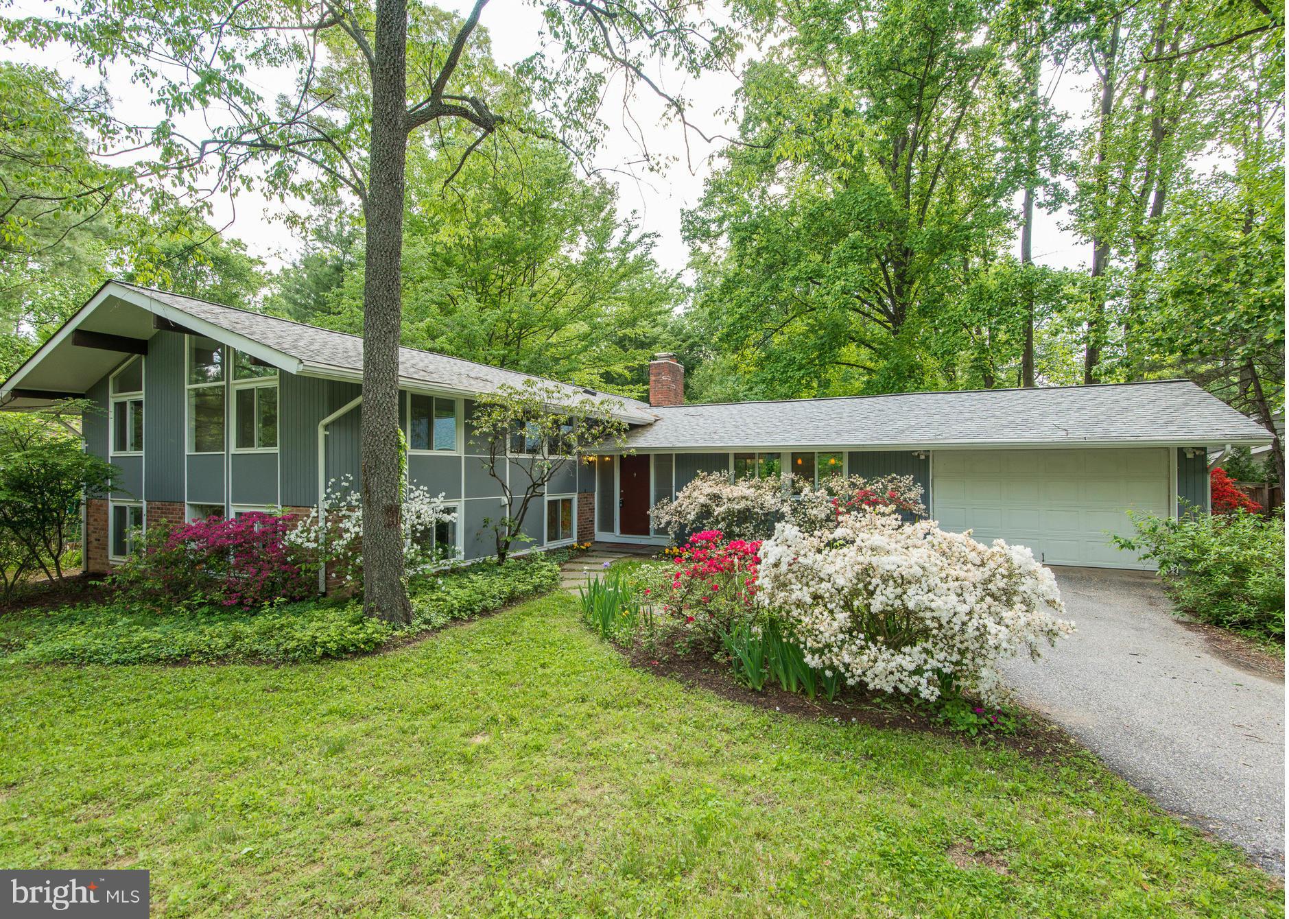 6718 Persimmon Tree Road Bethesda, MD 20817 - Photo 1 of 30 a view of a house with garden