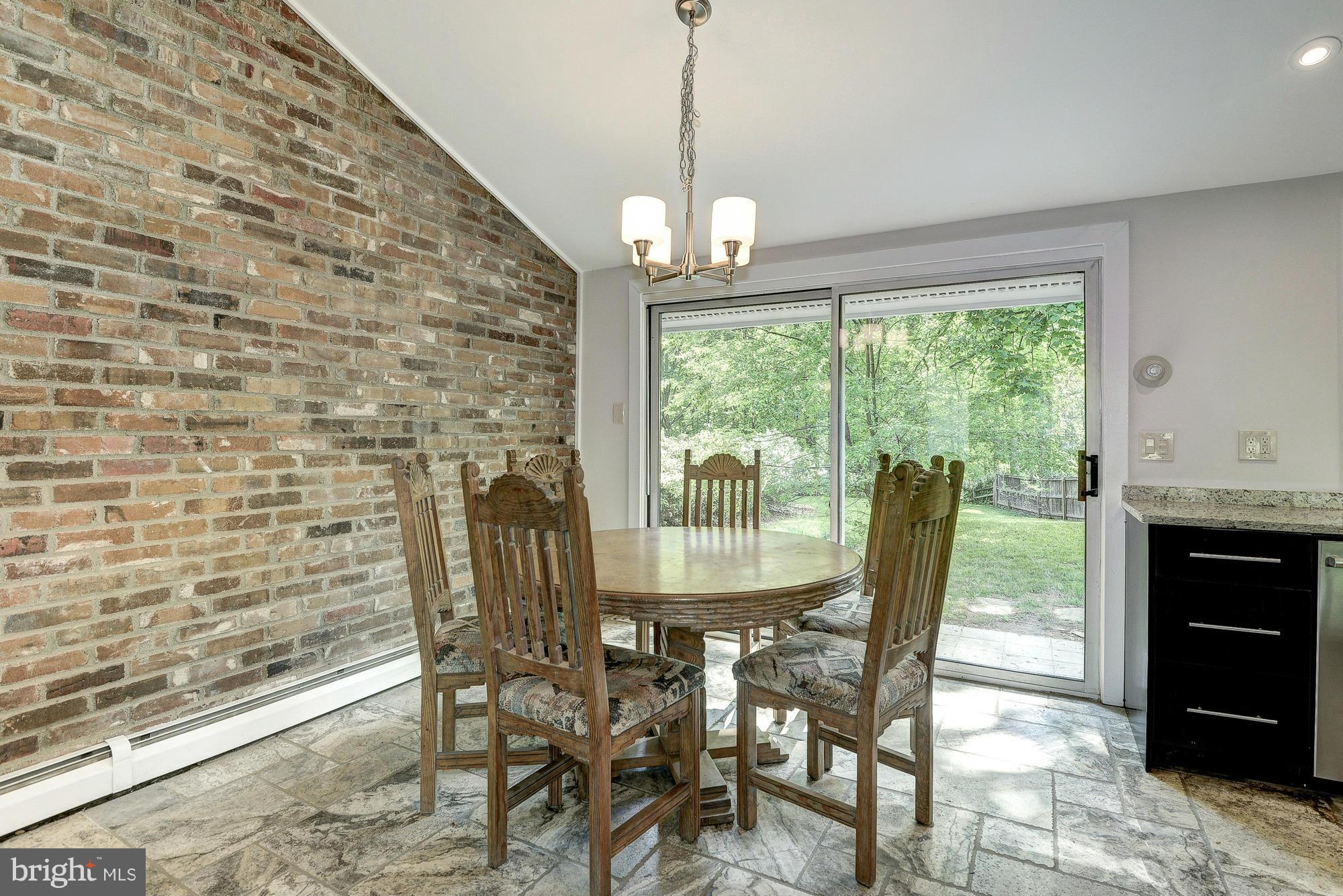 6718 Persimmon Tree Road Bethesda, MD 20817 - Photo 13 of 30 a view of a dining room with furniture window and outside view