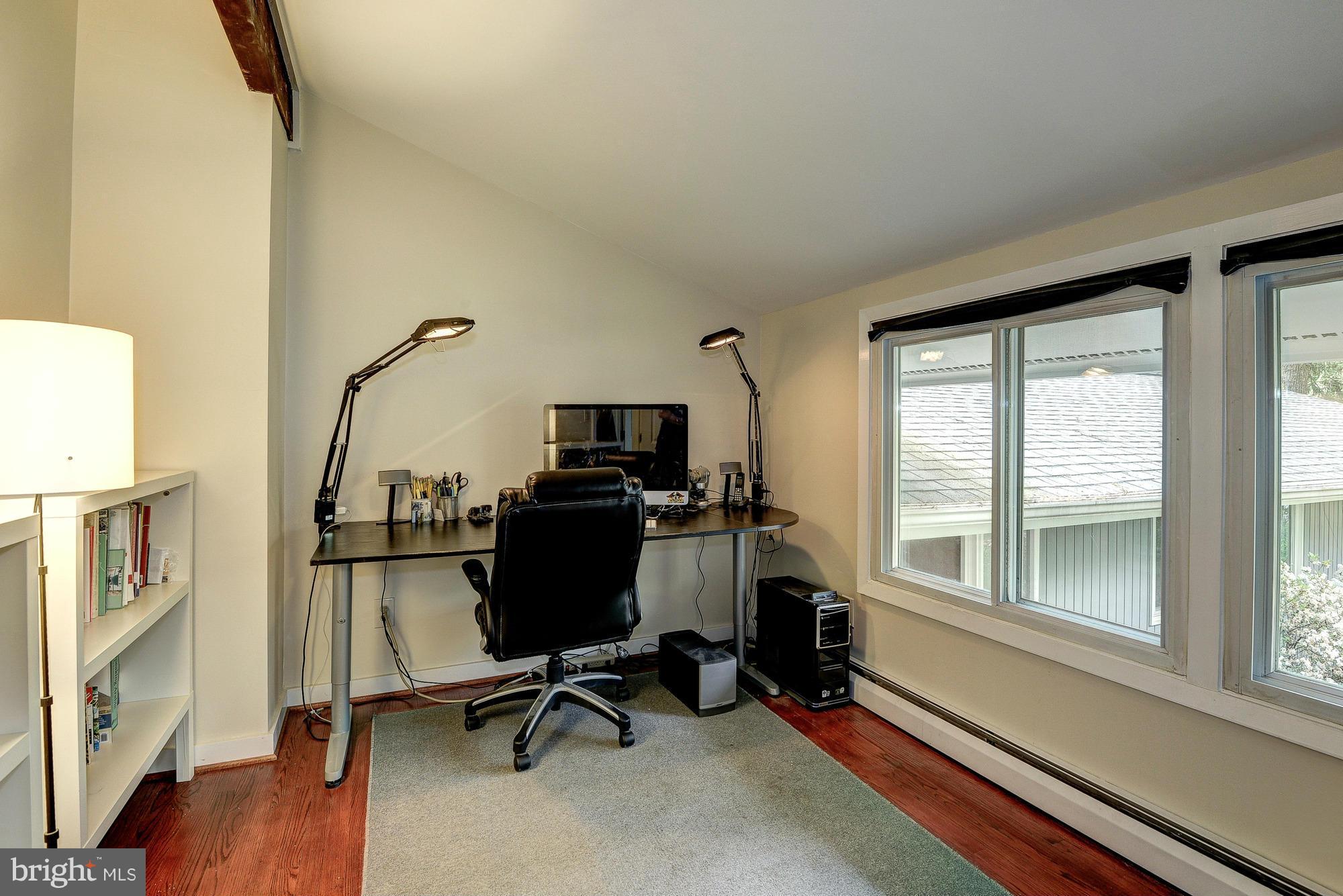 6718 Persimmon Tree Road Bethesda, MD 20817 - Photo 16 of 30 a view of a workspace with furniture and a window