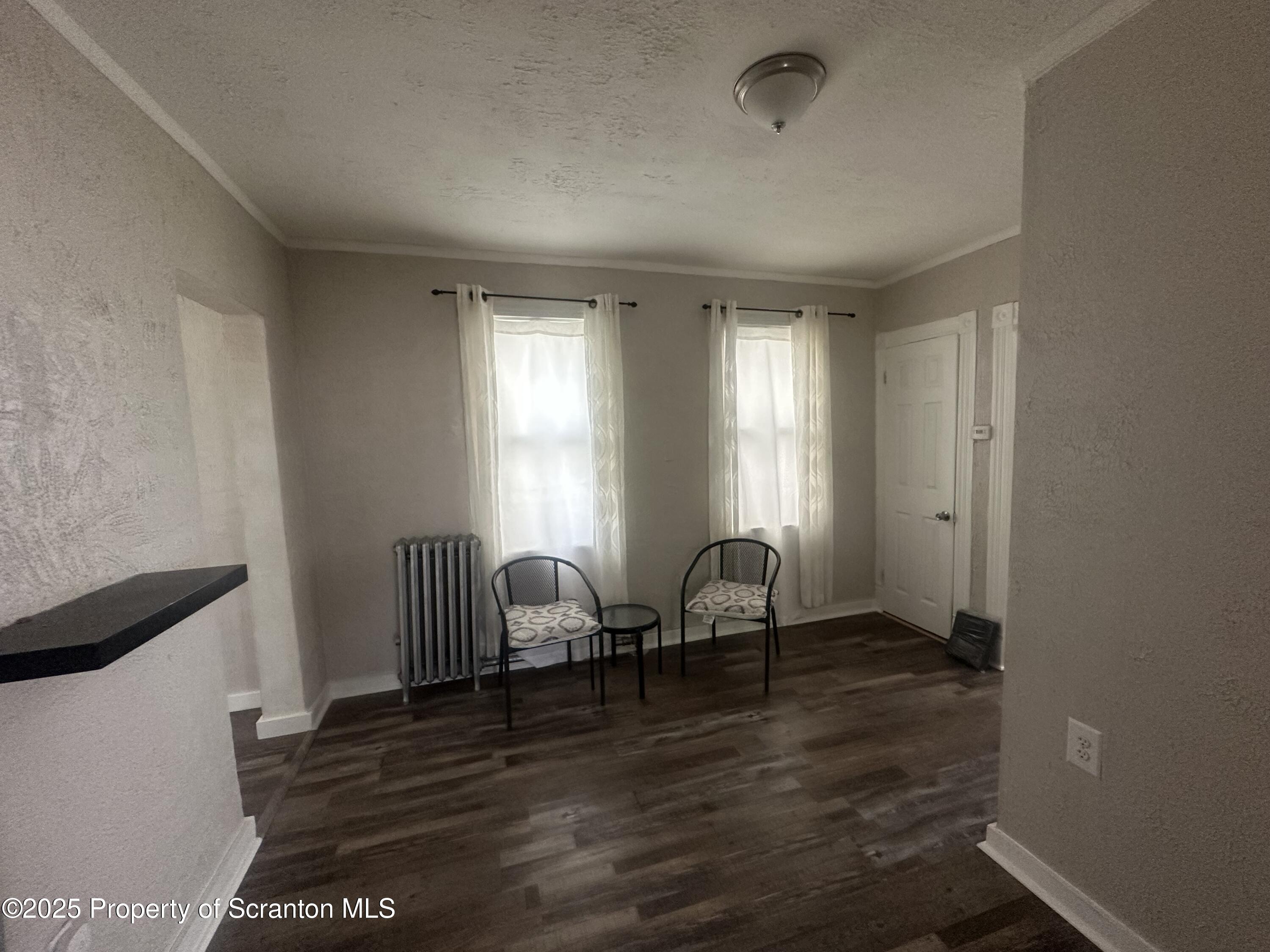 821 Maple Street Scranton, PA 18505 - Photo 5 of 21 a view of room with wooden floor and windows