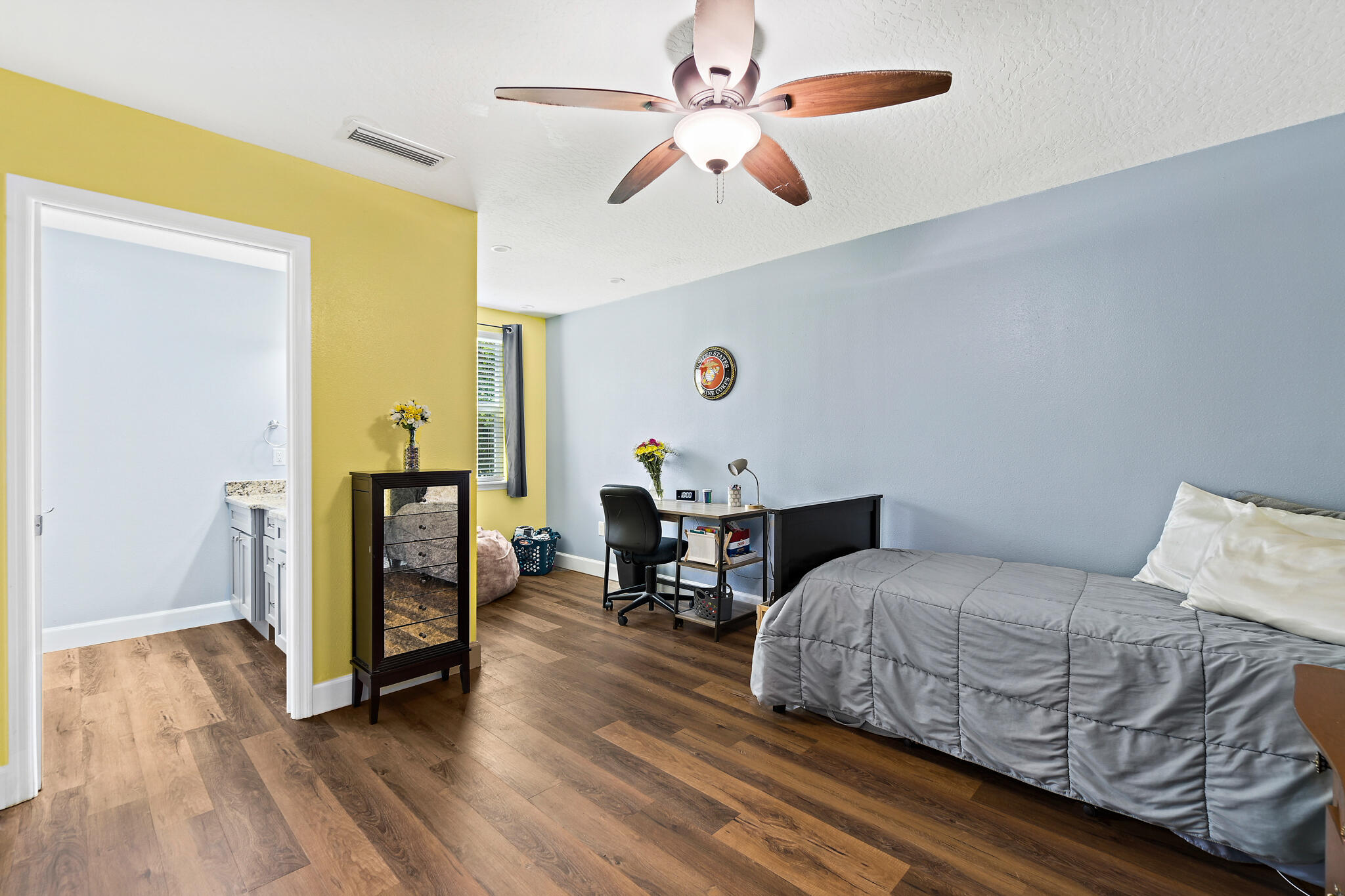 810 Knecht Road Northeast Palm Bay, FL 32905 - Photo 33 of 63 a bedroom with a bed and a chandelier