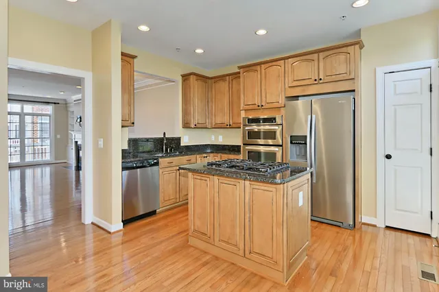 a living room with a stove and a window
