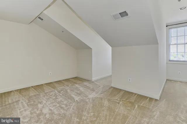 a front view of a house with outdoor seating