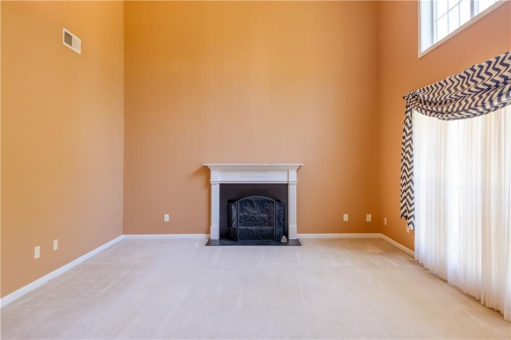 640 Fitzgerald Place Atlanta, GA 30349 - Photo 11 of 46 a view of an empty room with a fireplace