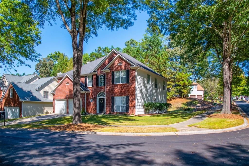 640 Fitzgerald Place Atlanta, GA 30349 - Photo 2 of 46 a view of a house with a yard