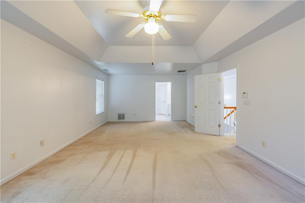 640 Fitzgerald Place Atlanta, GA 30349 - Photo 29 of 46 a view of an empty room with a ceiling fan