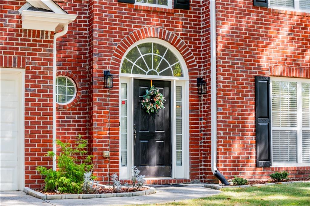 640 Fitzgerald Place Atlanta, GA 30349 - Photo 3 of 46 a front view of a house with a garden