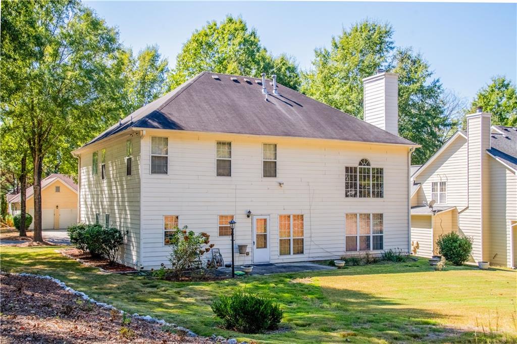 640 Fitzgerald Place Atlanta, GA 30349 - Photo 40 of 46 a view of a house with a yard