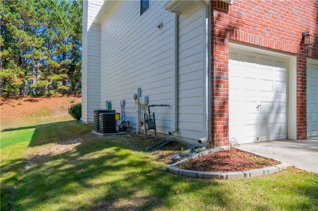 640 Fitzgerald Place Atlanta, GA 30349 - Photo 44 of 46 a backyard of a house with yard and outdoor seating