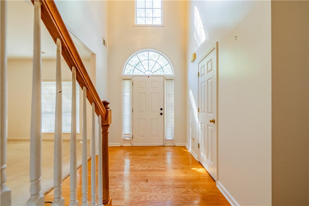640 Fitzgerald Place Atlanta, GA 30349 - Photo 5 of 46 a view of an entryway with wooden floor and door