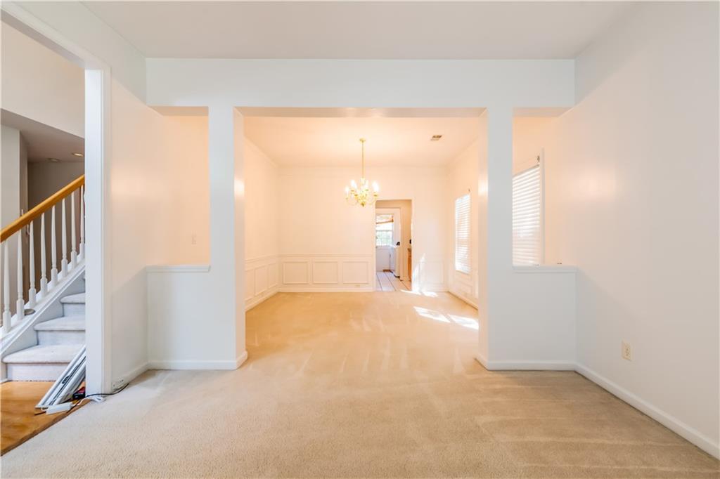 640 Fitzgerald Place Atlanta, GA 30349 - Photo 7 of 46 a view of a hallway with wooden floor and a bathroom