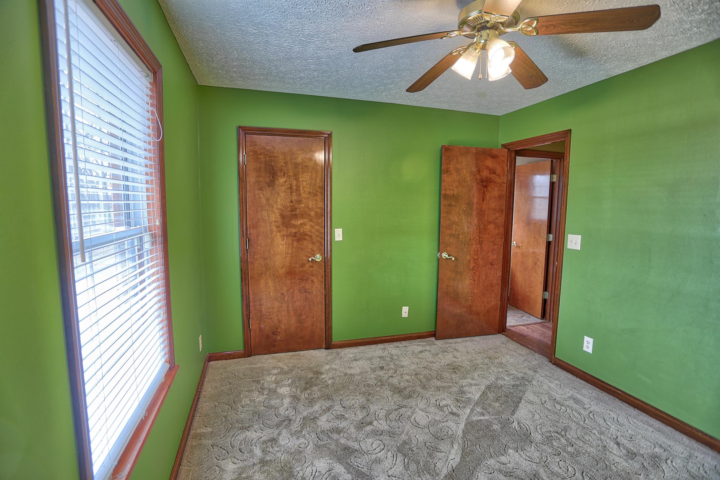4322 Dot Road Springfield, TN 37172 - Photo 13 of 22 a view of a room that has a bed and a chandelier fan