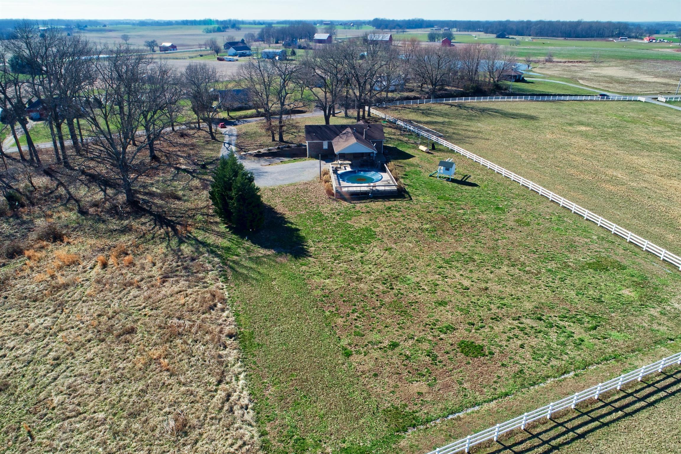 4322 Dot Road Springfield, TN 37172 - Photo 19 of 22 a view of a swimming pool with an outdoor seating and yard