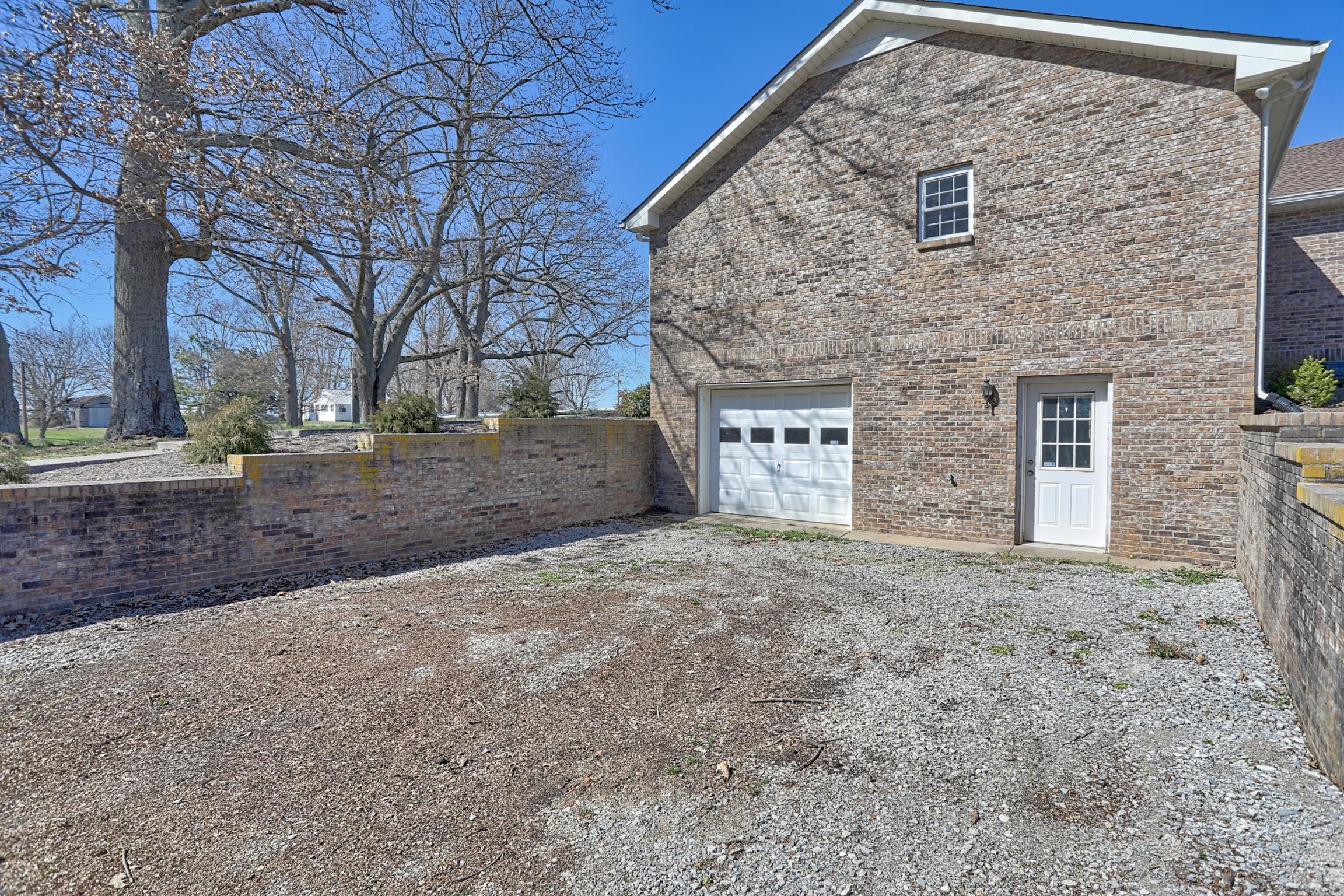 4322 Dot Road Springfield, TN 37172 - Photo 22 of 22 a front view of a house with a yard and garage