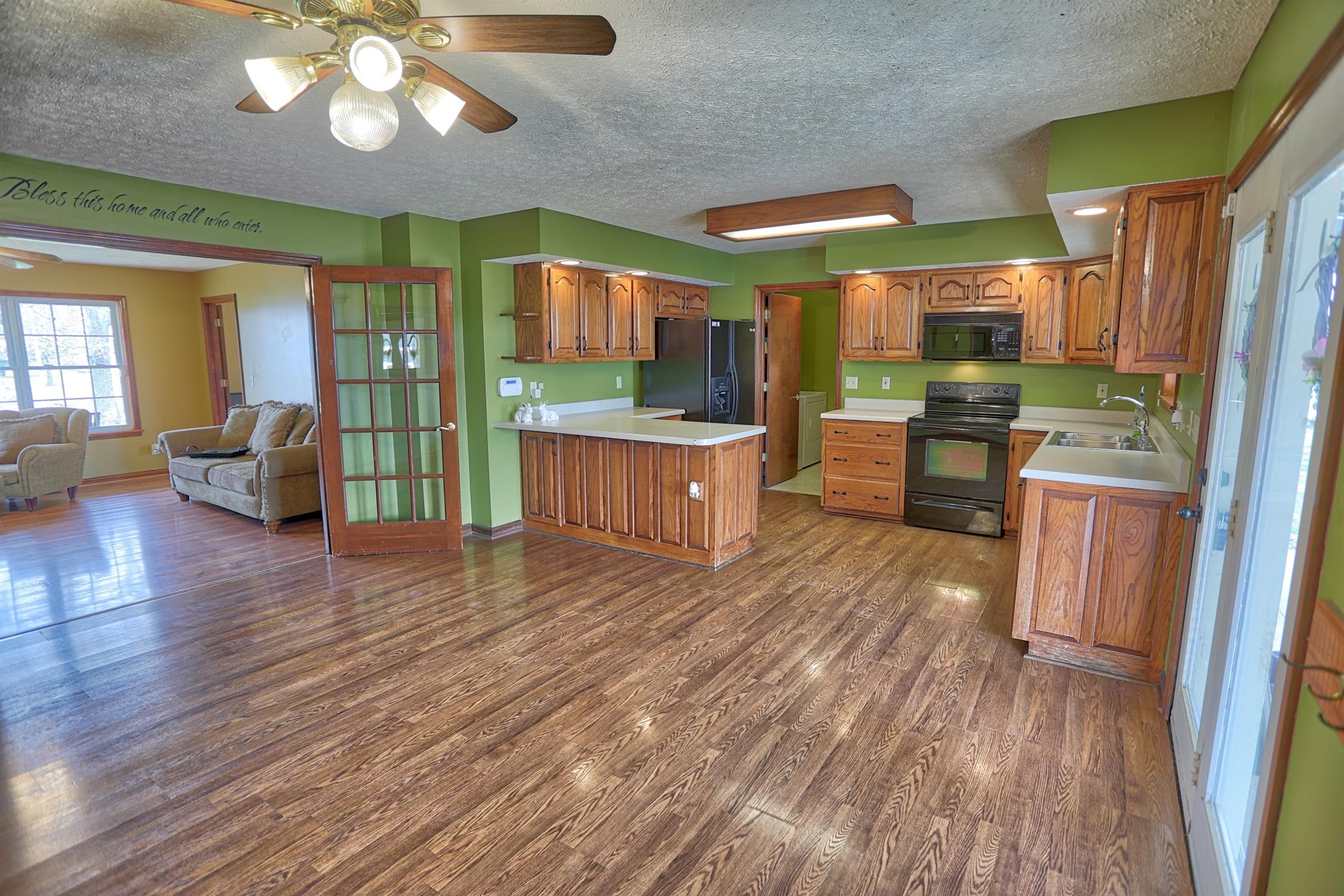 4322 Dot Road Springfield, TN 37172 - Photo 5 of 22 a living room with stainless steel appliances granite countertop furniture wooden floor and a view of kitchen