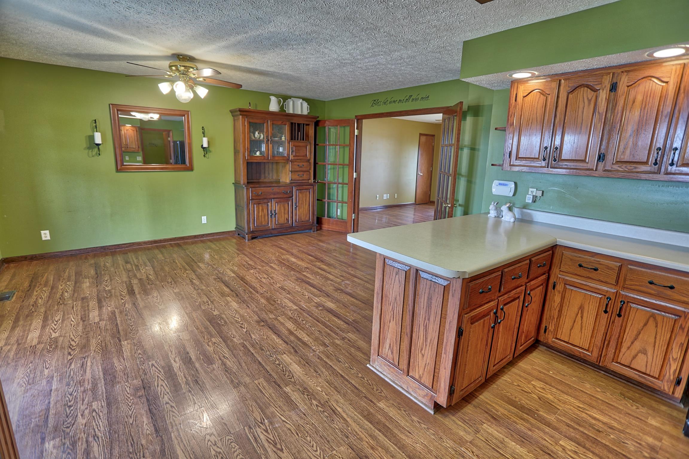 4322 Dot Road Springfield, TN 37172 - Photo 6 of 22 a open kitchen with kitchen island a sink dishwasher stove and cabinets with wooden floor