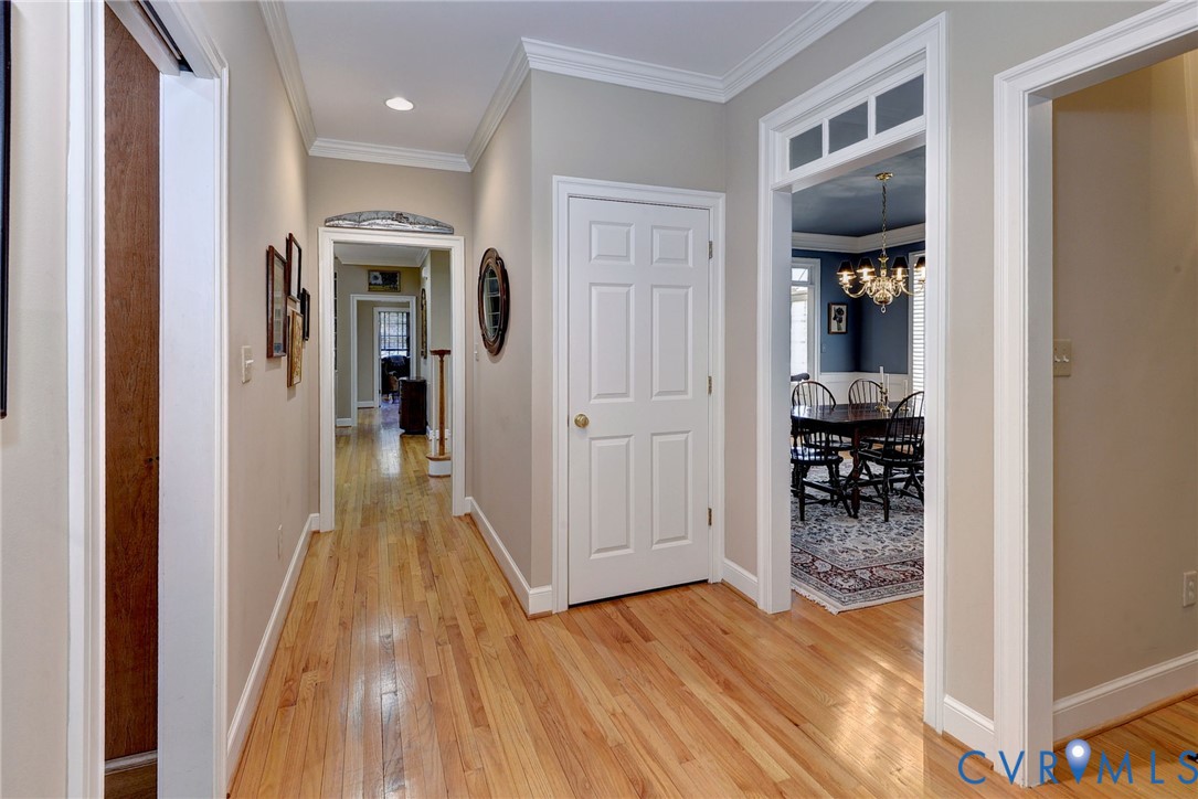 1613 River Ridge Williamsburg, VA 23185 - Photo 25 of 82 Corridor with crown molding, light wood-type floor
