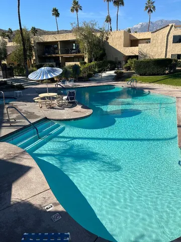 a view of a balcony with wooden floor