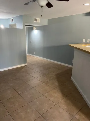 an empty room with shelves