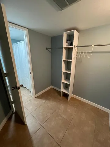 a view of an empty walk in closet