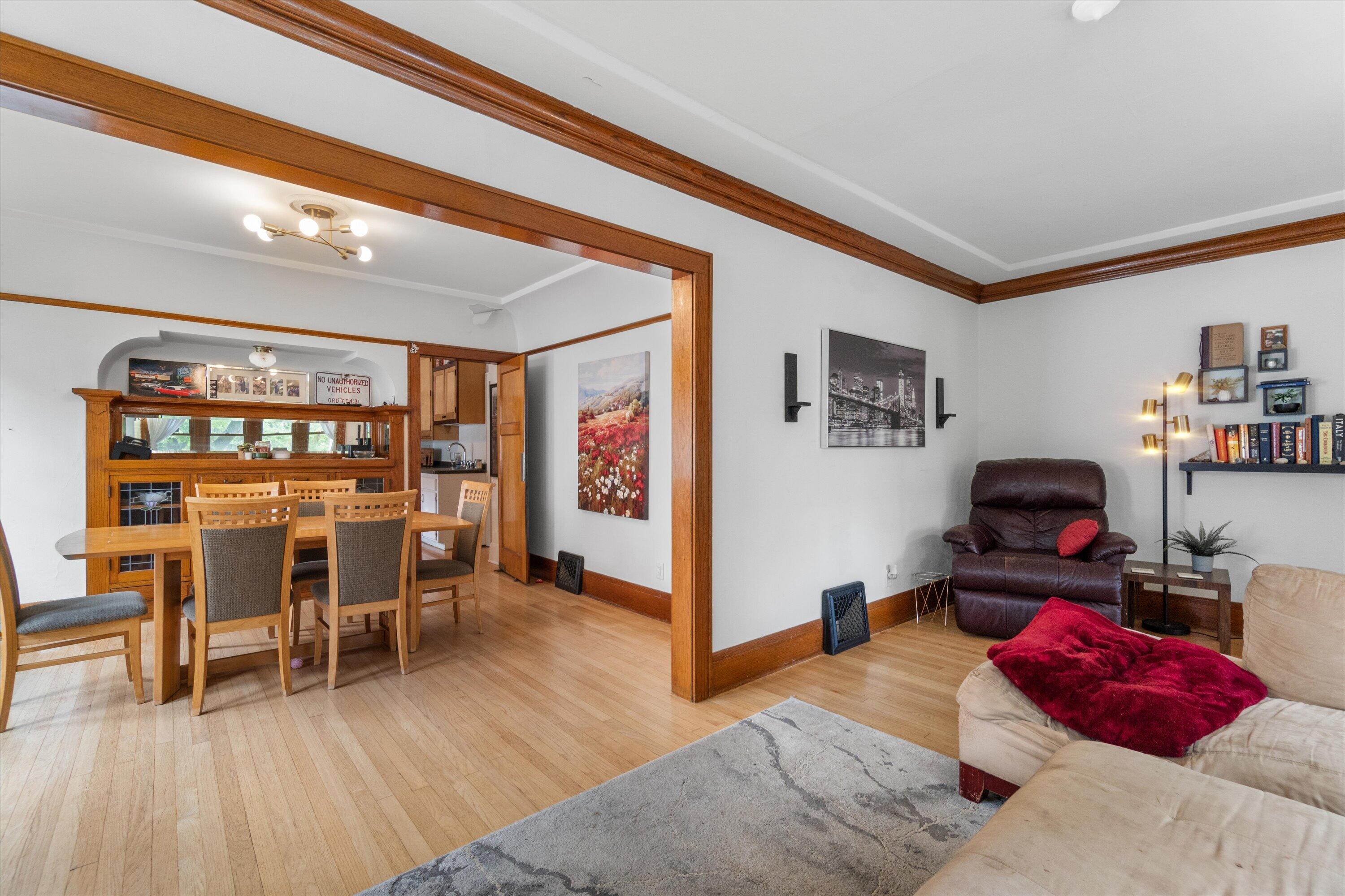 159 North 59th Street Milwaukee, WI 53213 - Photo 29 of 34 Open-concept living and dining area highlighted by built-in shelving and classic architectural details