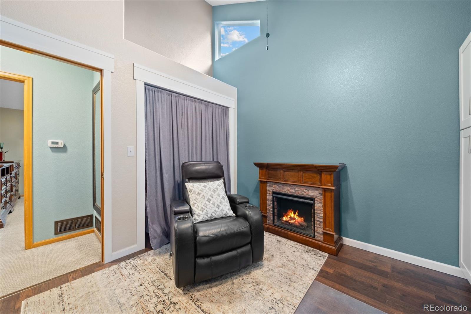 609 Gold Flake Terrace Bailey, CO 80421 - Photo 18 of 47 a living room with furniture and a fireplace