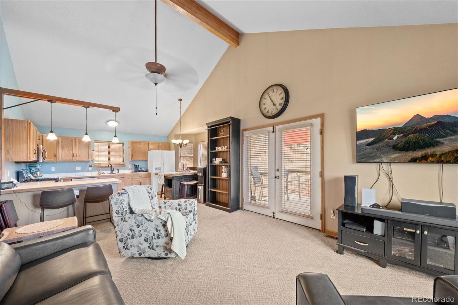 609 Gold Flake Terrace Bailey, CO 80421 - Photo 2 of 47 a living room with furniture and a large window