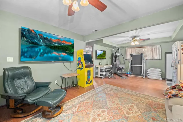a view of a livingroom with furniture and a flat screen tv