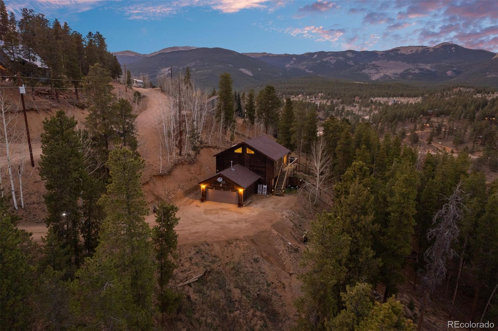 609 Gold Flake Terrace Bailey, CO 80421 - Photo 29 of 47 a view of a town with mountains in the background