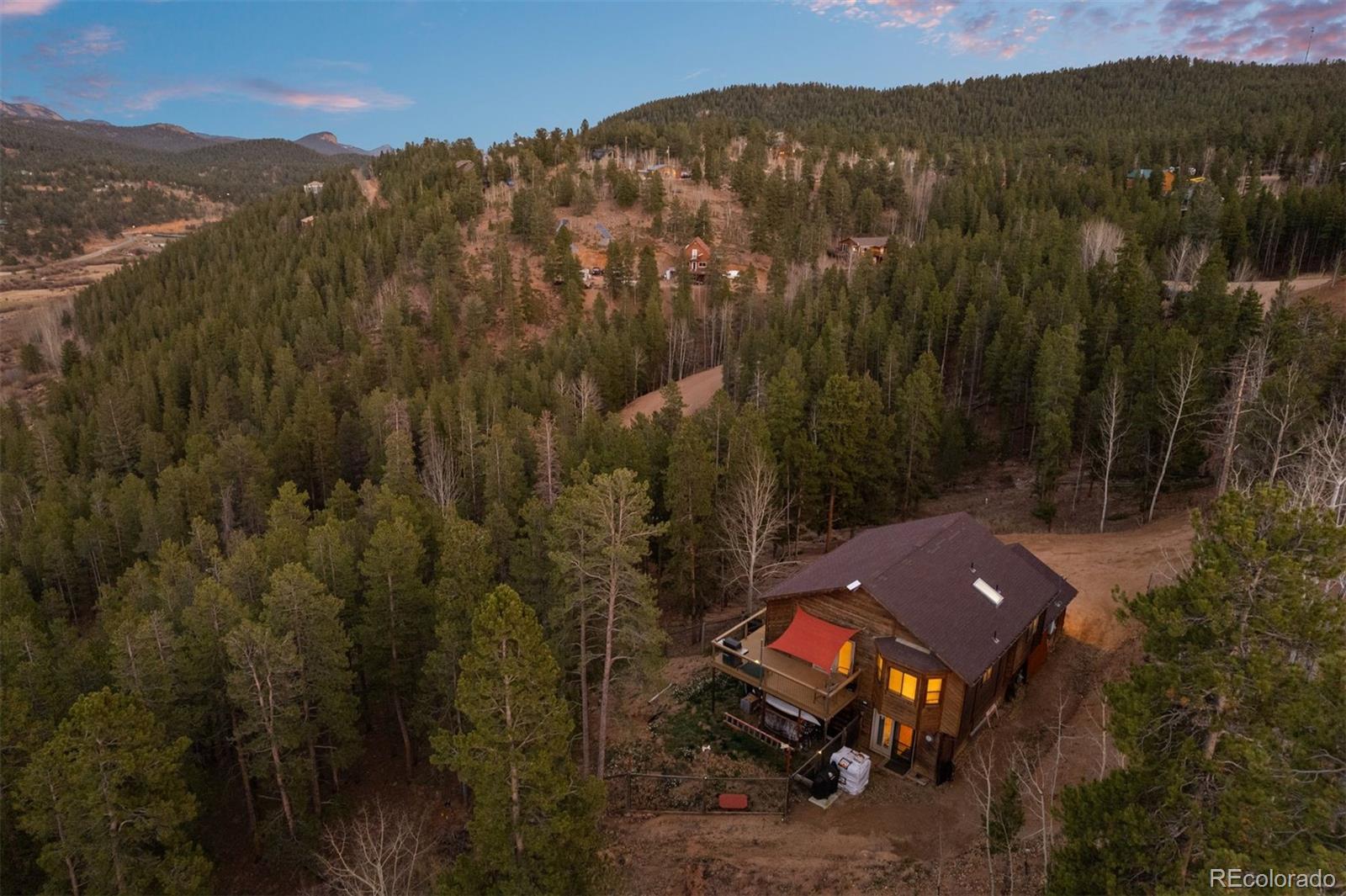 609 Gold Flake Terrace Bailey, CO 80421 - Photo 30 of 47 a view of a town with mountains in the background