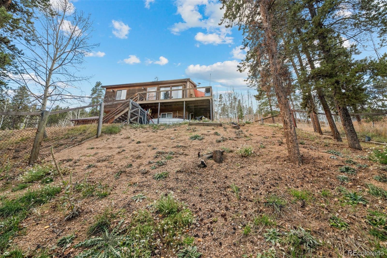 609 Gold Flake Terrace Bailey, CO 80421 - Photo 36 of 47 a view of a house with a yard