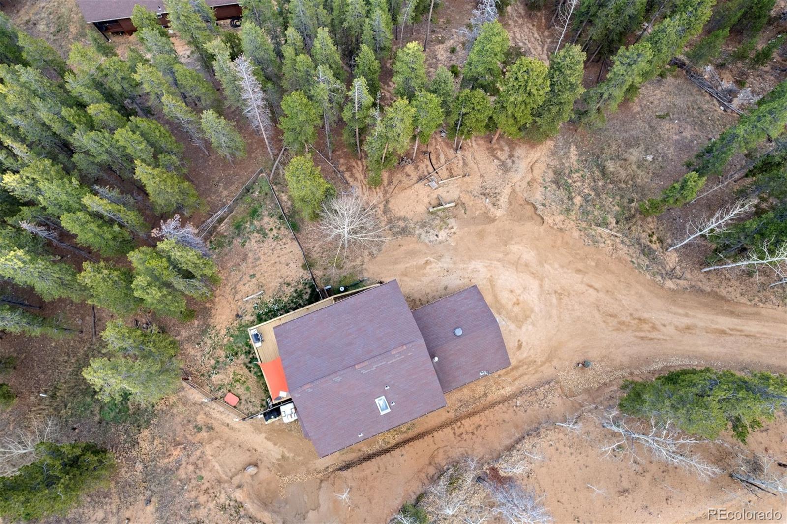 609 Gold Flake Terrace Bailey, CO 80421 - Photo 40 of 47 an aerial view of a house with a yard