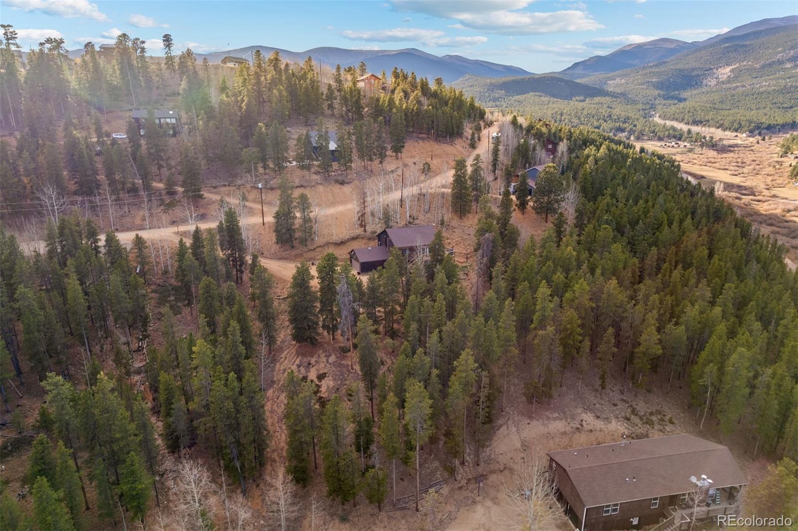 609 Gold Flake Terrace Bailey, CO 80421 - Photo 41 of 47 a view of a city with mountains in the background