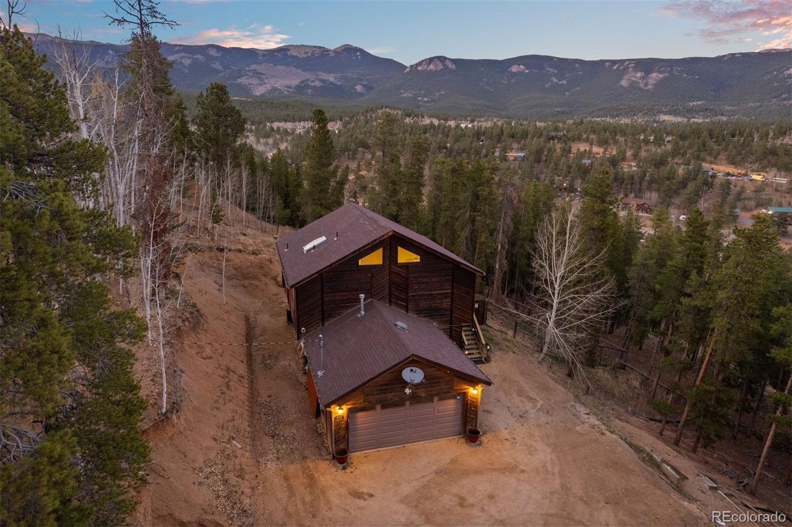 609 Gold Flake Terrace Bailey, CO 80421 - Photo 43 of 47 a view of a mountain with a swimming pool