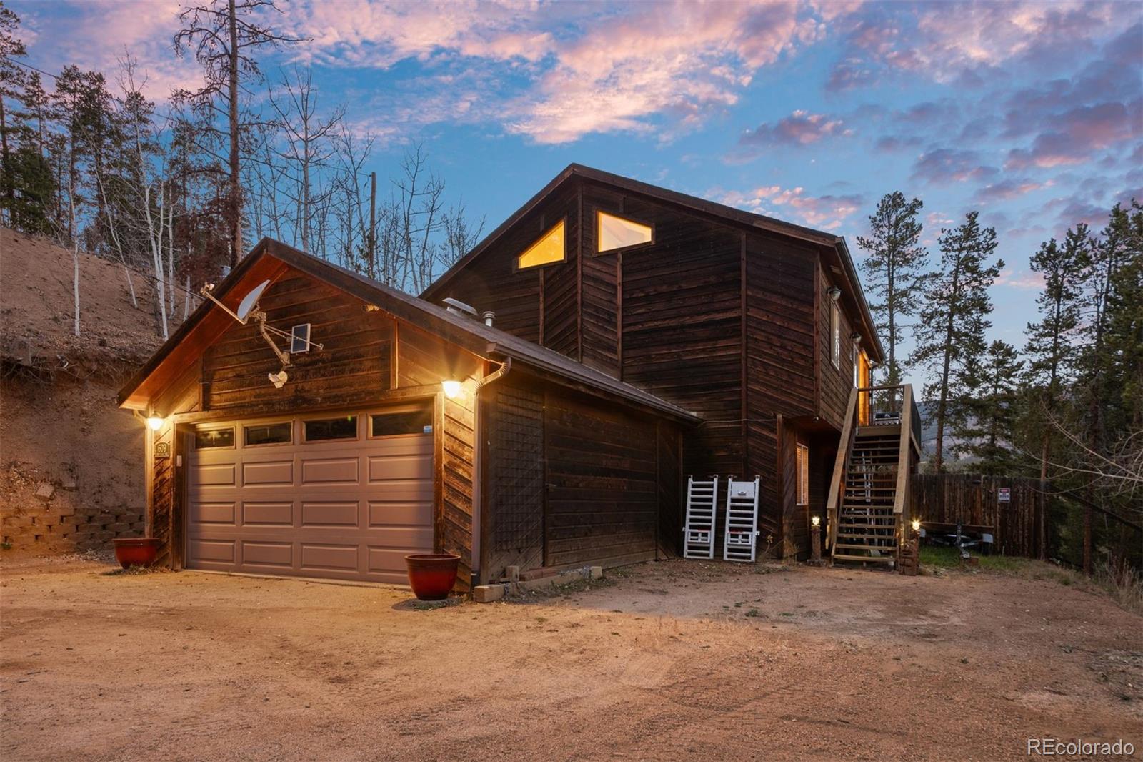609 Gold Flake Terrace Bailey, CO 80421 - Photo 44 of 47 a view of a house with a snow in the background