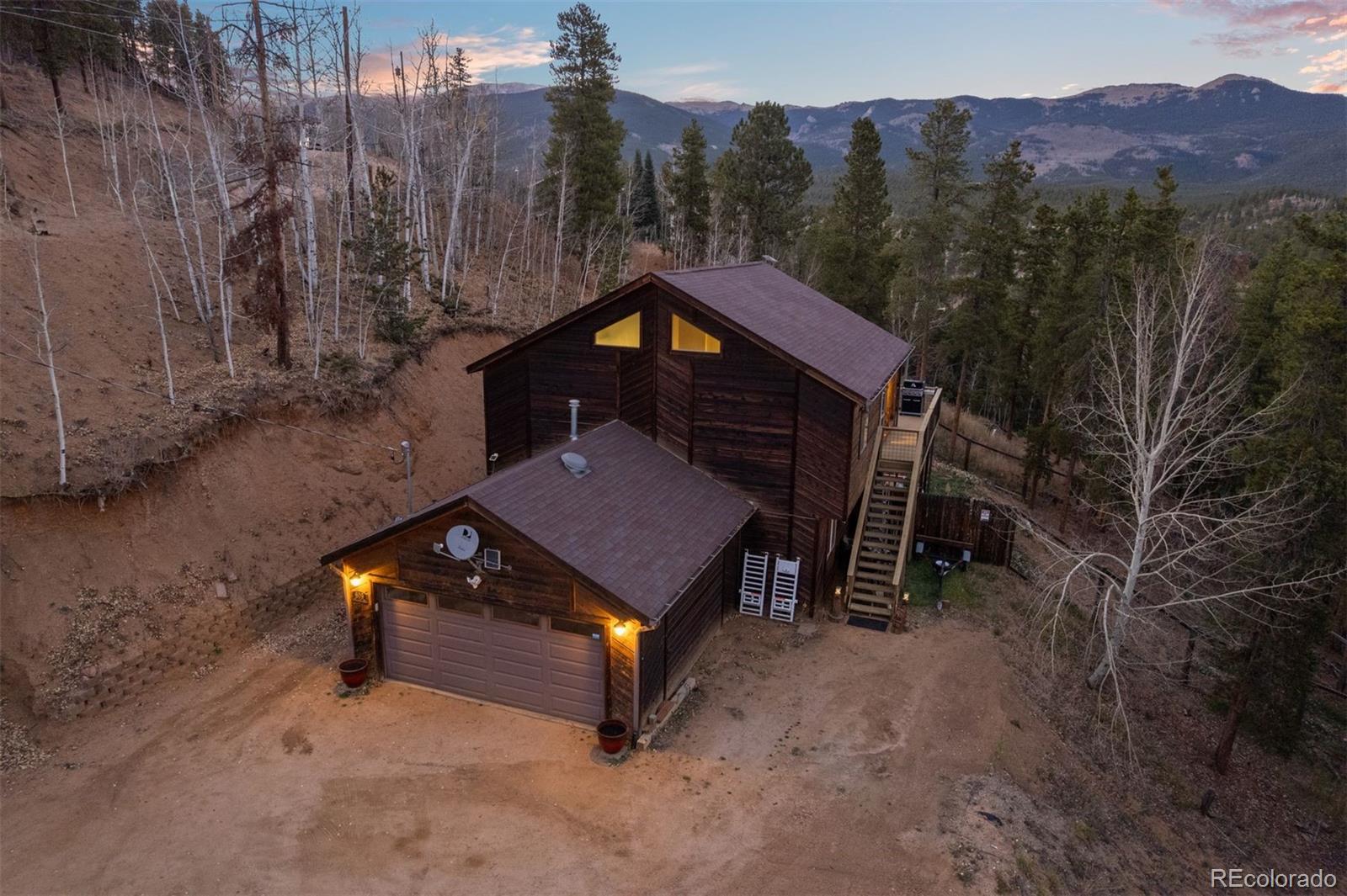 609 Gold Flake Terrace Bailey, CO 80421 - Photo 45 of 47 a view of a house with a yard