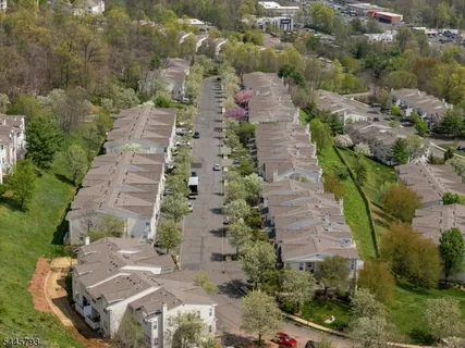 an aerial view of a house with outdoor space